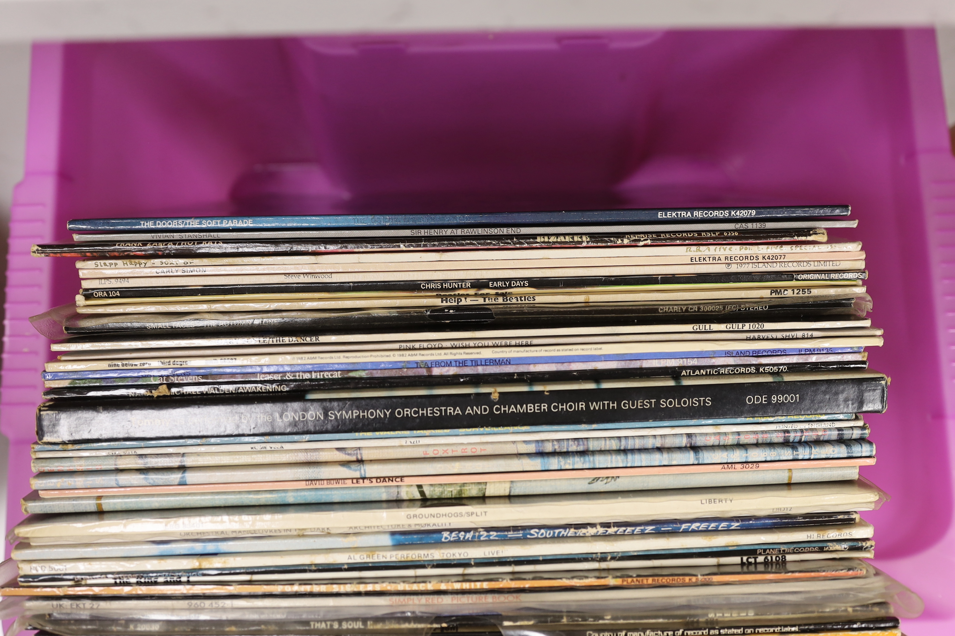 Thirty-eight LP record albums by artists including; The Doors, Carly Simon, Slap Happy, Frank Zappa, Steve Winwood, Chris Hunter, the Beatles, Pink Floyd, Cat Stevens, The Who, Genesis, etc. and to 12 inch singles by Are